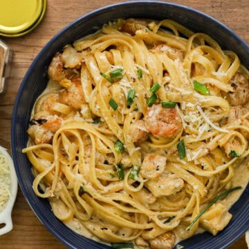 Cajun chicken and shrimp pasta in blue bowl