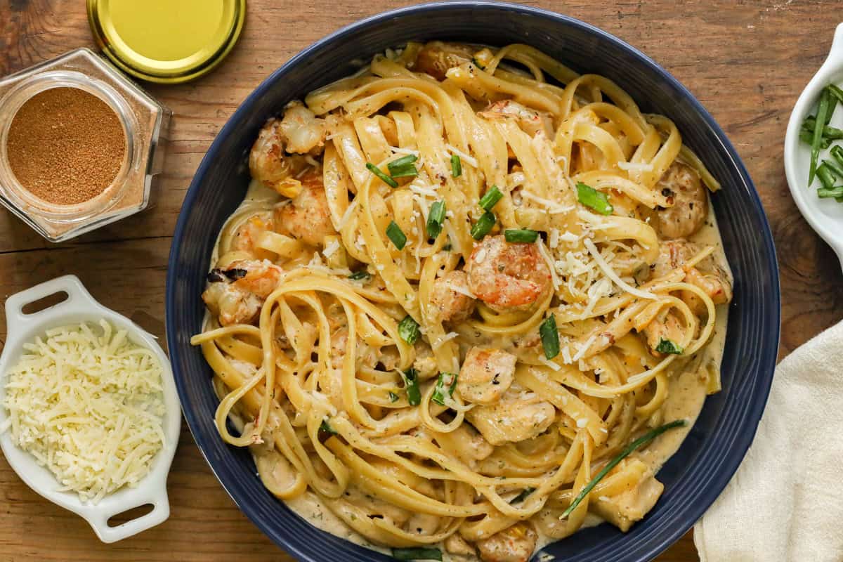Cajun chicken and shrimp pasta in blue bowl