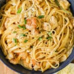 Cajun chicken and shrimp pasta in blue bowl