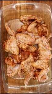 Chipotle Chicken Wings (Seasoned) in baking dish.