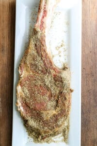 Seasoned Cowboy Steak on a white plate