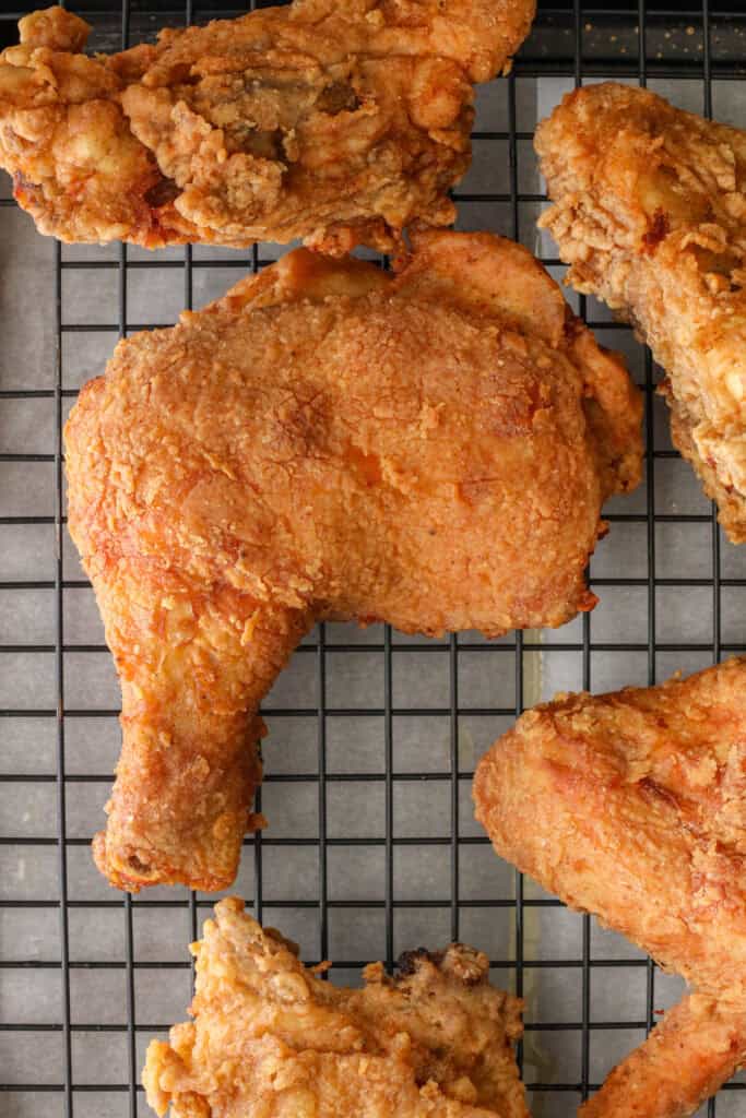 Louisiana Fried Chicken on a cooling rack.