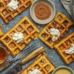 Pumpkin waffles topped with nuts and whipped cream