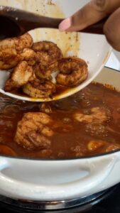 Adding shrimp to stew