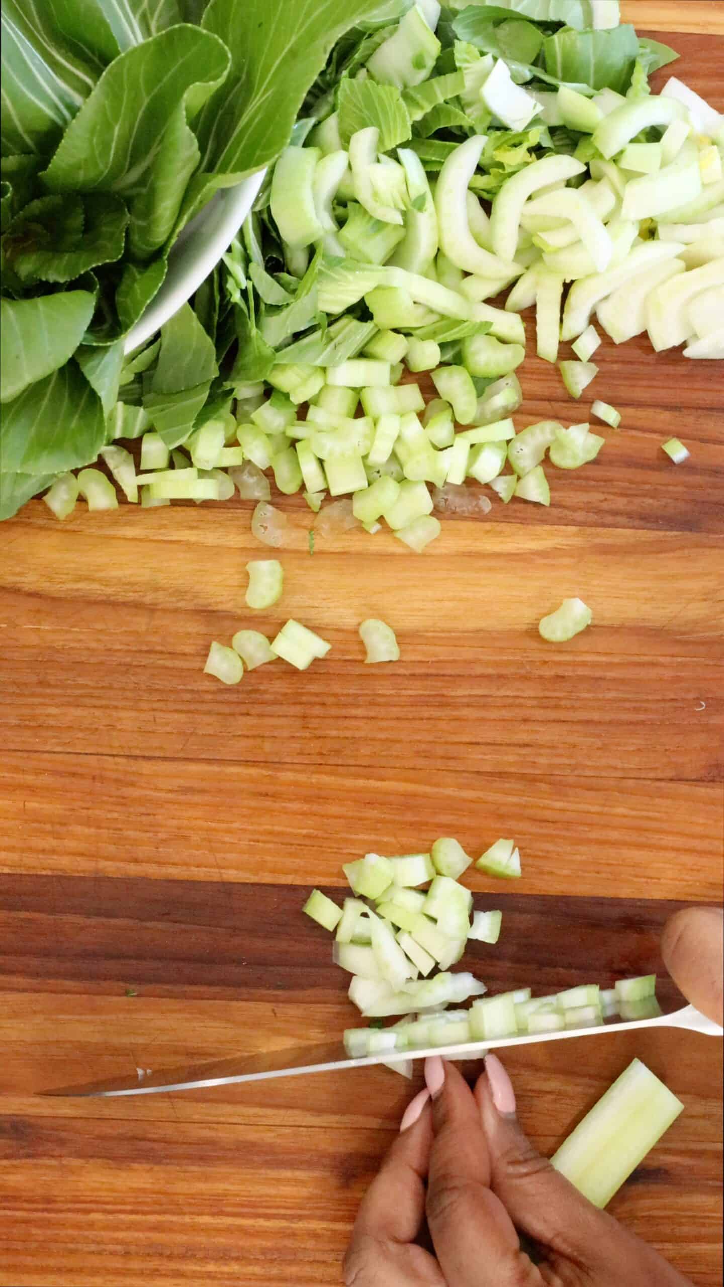 Chopping bok choy and vegetables
