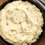 Skin on mashed potatoes in black bowl