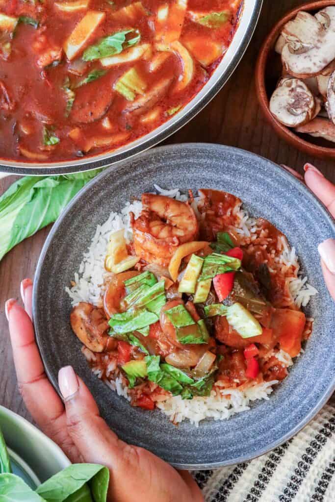 shrimp stew with Bok Choy in gray bowl with white rice