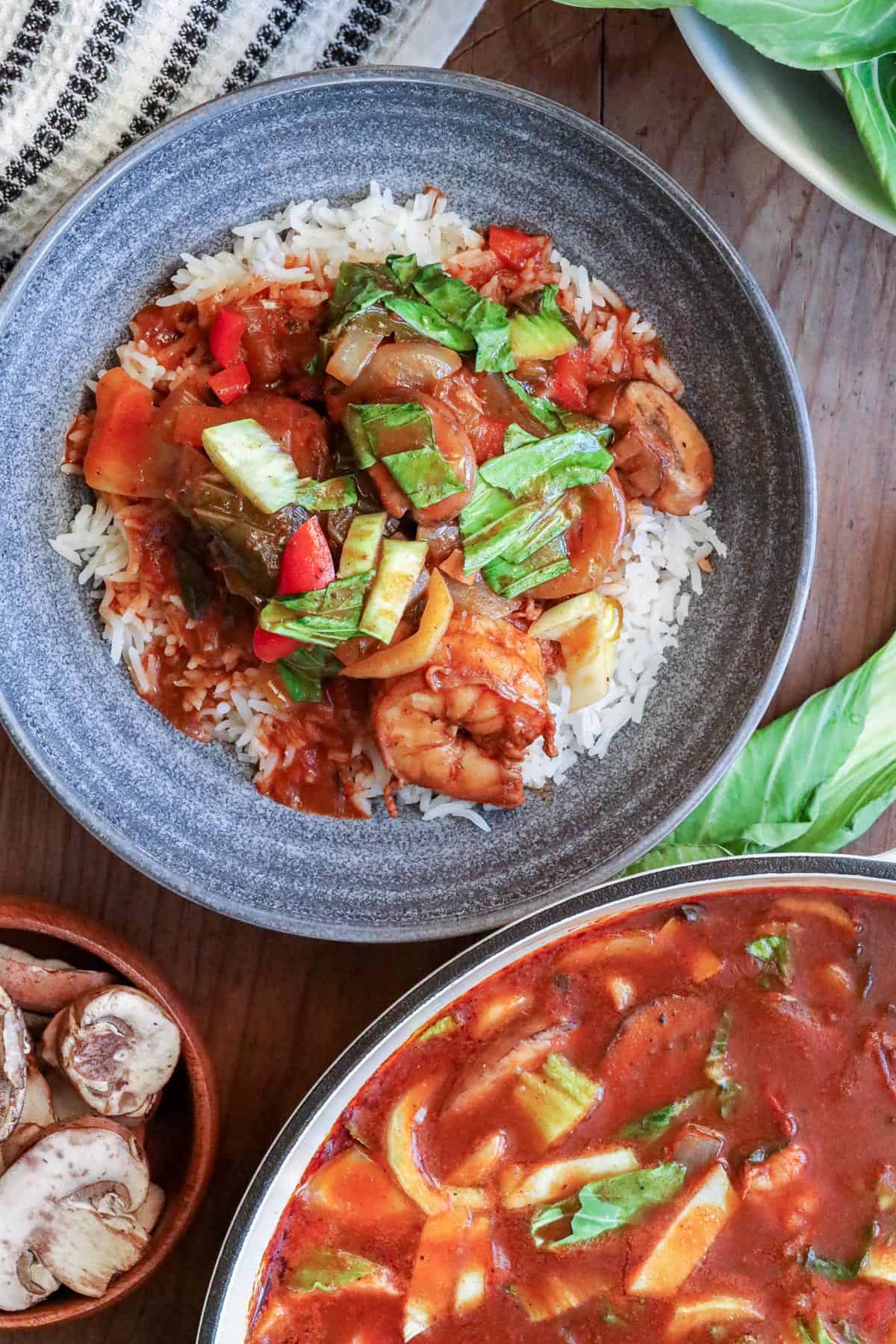 shrimp stew with Bok Choy over a bed of white rice.