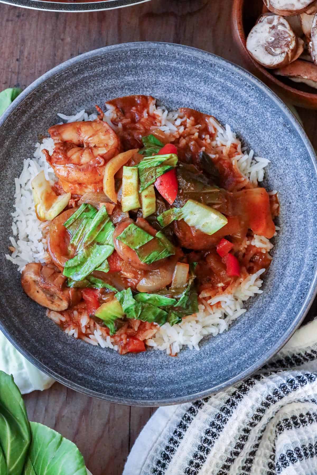 shrimp stew with Bok Choy in gray bowl