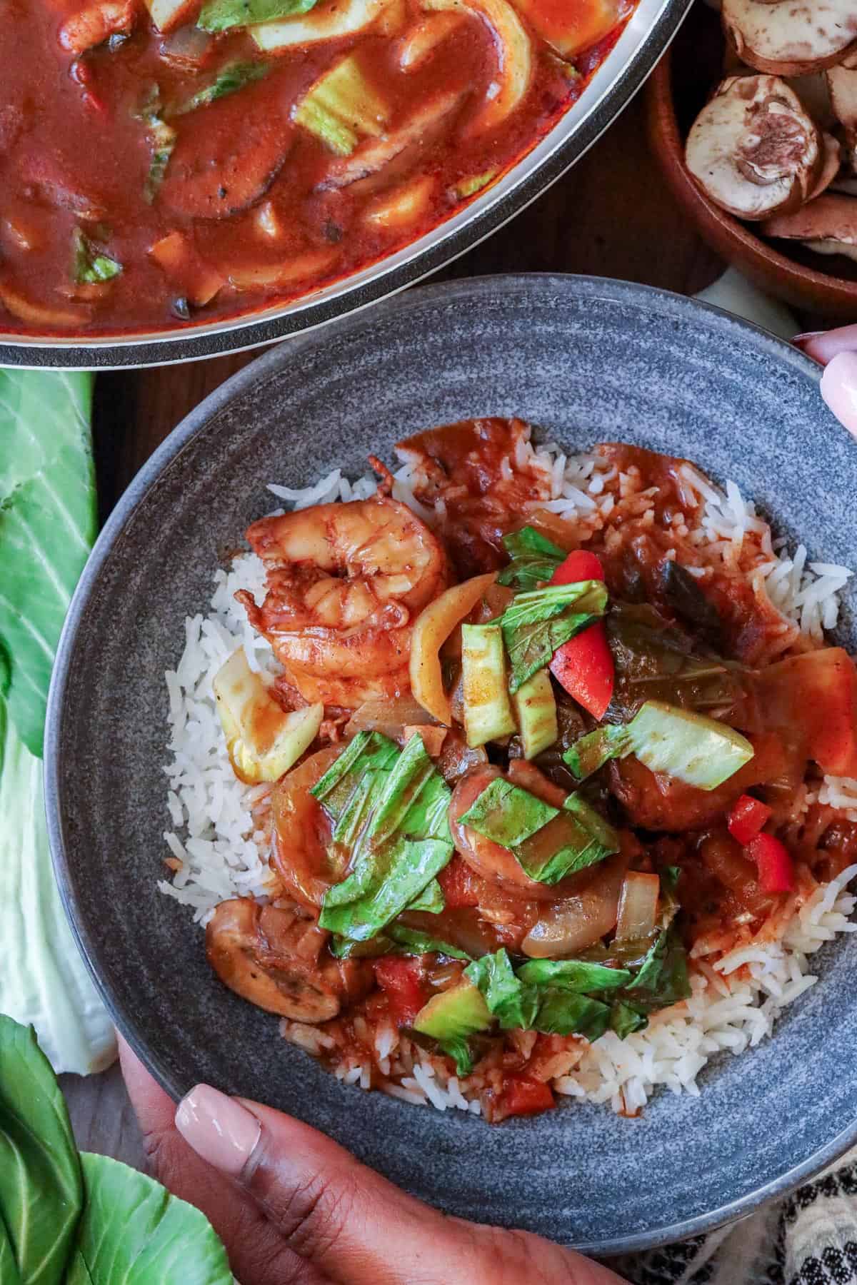 shrimp stew with Bok Choy in gray bowl