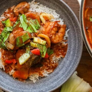 shrimp stew with Bok Choy in gray bowl with white rice