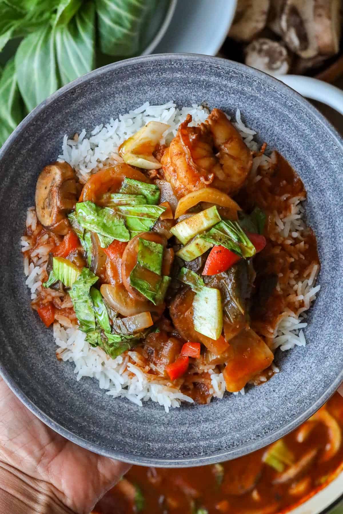 shrimp stew with Bok Choy in gray bowl with white rice