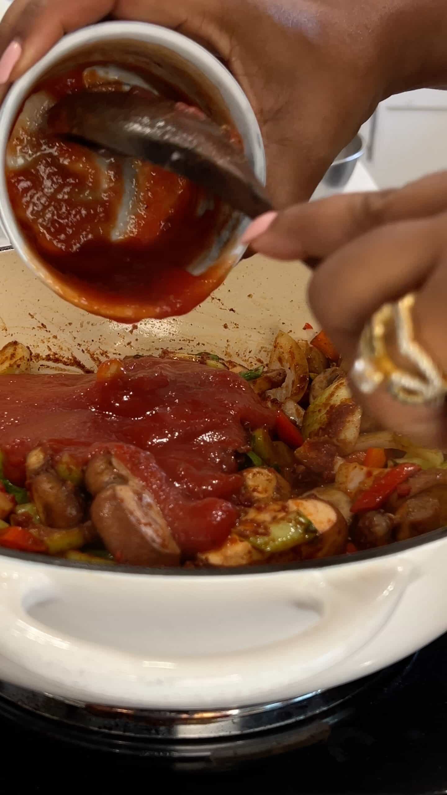 adding tomatoes to sautee vegetables