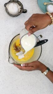 pouring milk in the batter