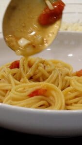 Adding sauce to Meghan Markle Pasta
