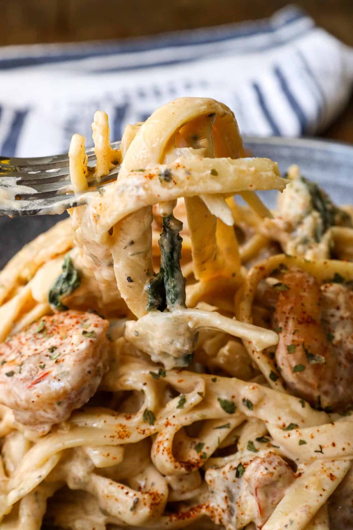 shrimp Alfredo With Spinach in gray bowl