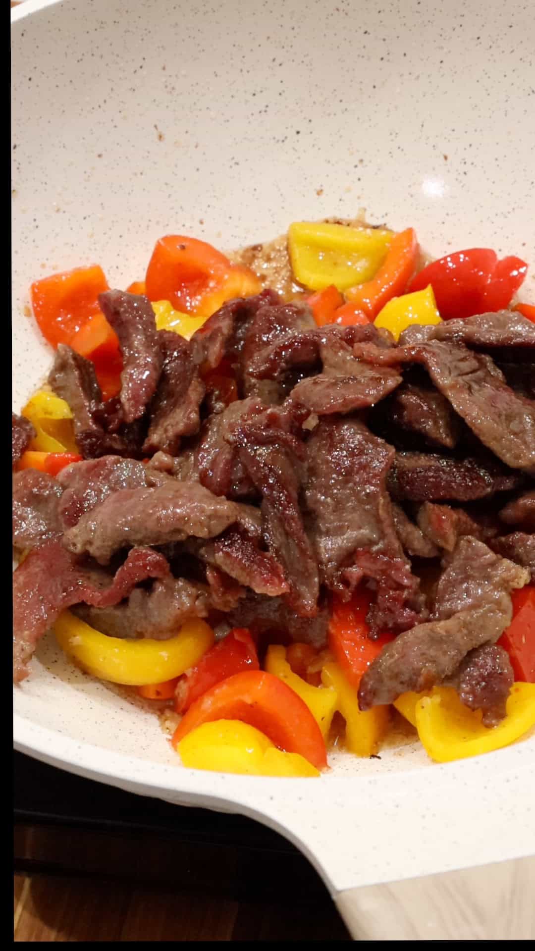 Adding beef to wok
