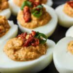 deviled eggs with crab meat topped with chives