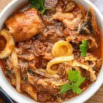Cooked Sos Morue (Mori - Haitian Cod Stew - Poisson Sale) in white plate