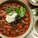 turkey bean chili with cilantro and jalapeño in bowl