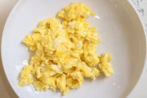 scrambled eggs on white plate