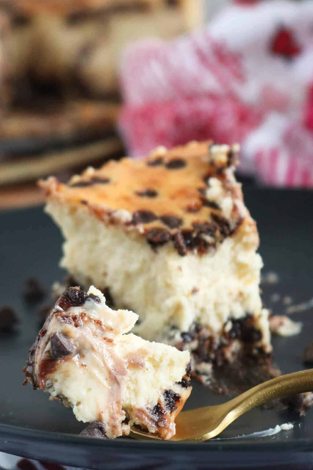 Cheesecake slice on black plate