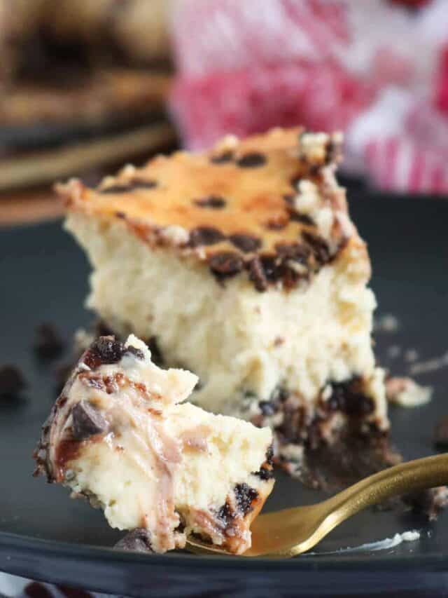 Cheesecake slice on black plate