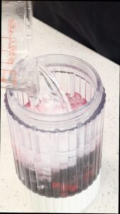 Frozen Berry Margarita Recipe -pouring club soda