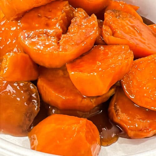 Cooked stovetop candied yams in white bowl