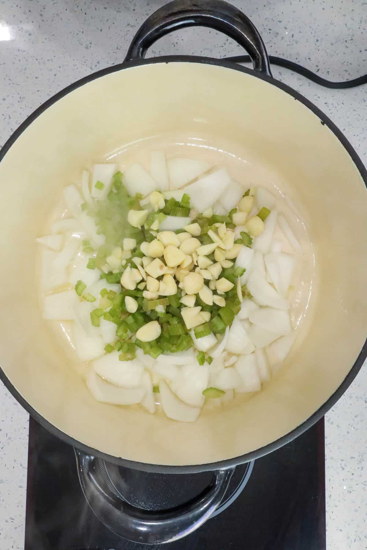Sautéing the ingredients - celery, garlic, and onions