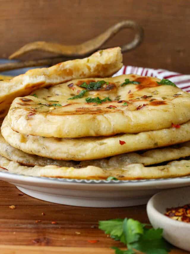 naan bread stacked on plate