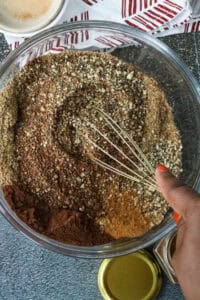 mixing Homemade Chocolate Protein glass in wooden bowl