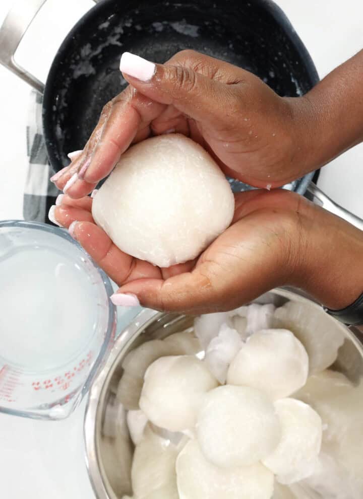Hand shaping Ghanaian Omo Tuo (Rice Balls)