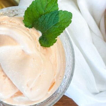 Papaya Ice Cream in glass bowl with mint