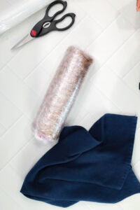 Ube Swiss cake roll wrapped in plastic