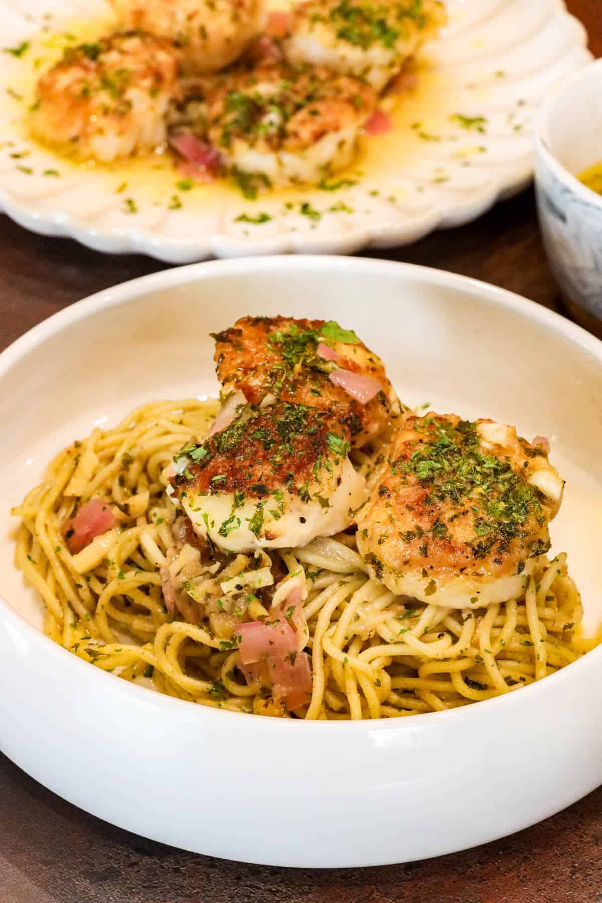Scallop Provençal on a bed of pasta