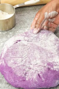 lightly floured Ube donut dough