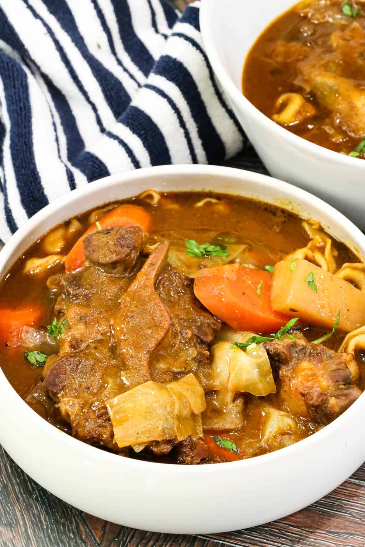 oxtail soup joumou in white bowl