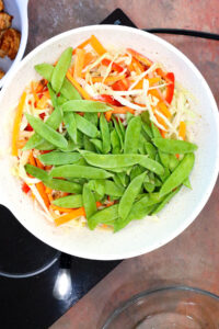 sautéing vegetables in wok