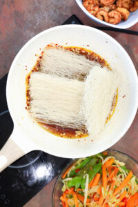 cooking noodles in wok