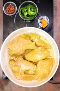 cooking turkey in white saucepan