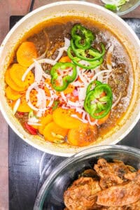 mixed vegetables in white sos pan to prepare turkey stew